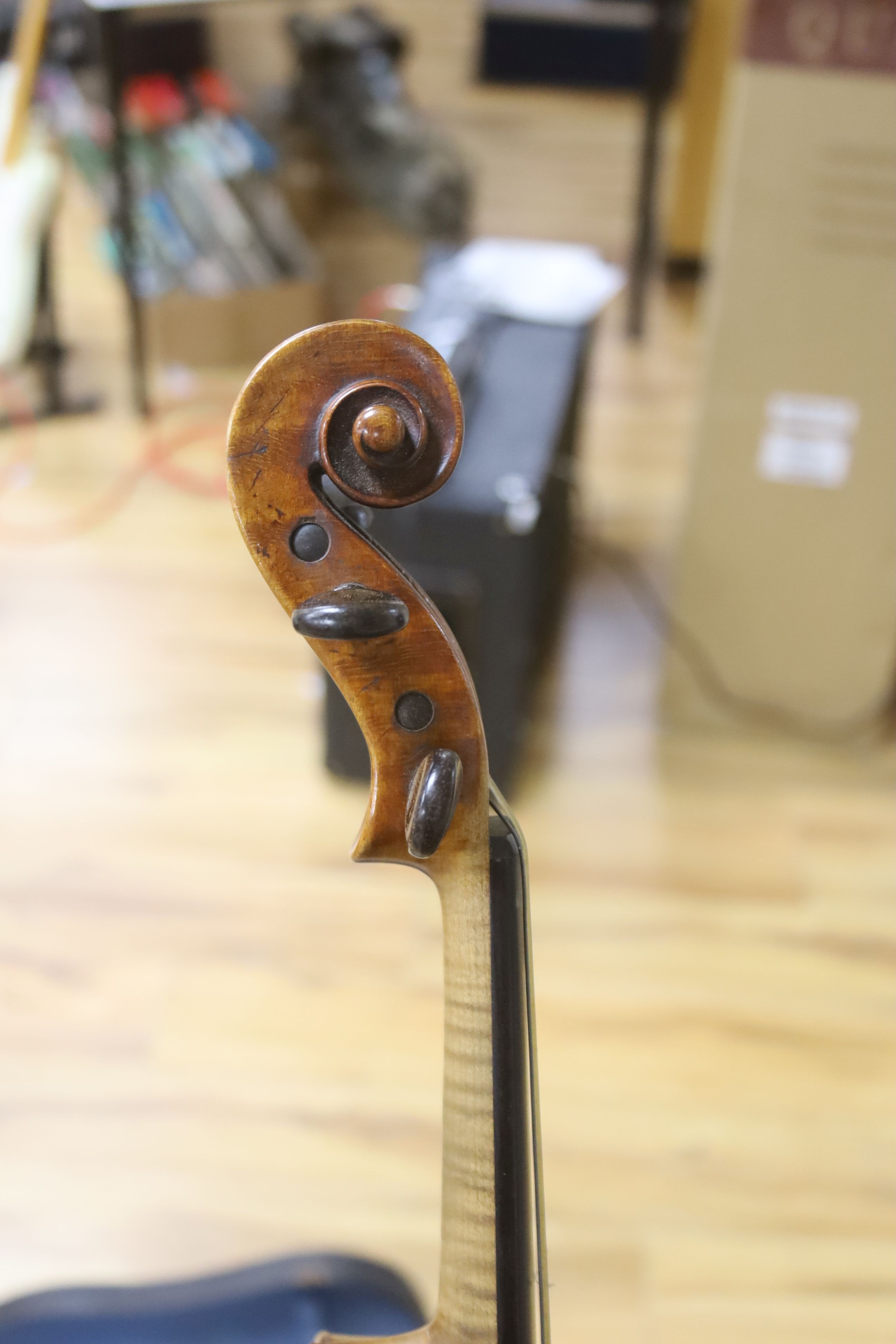 A cased violin and bow